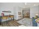 Loft area with study space, casual seating, wainscotting, and stylish decor at 111 Augusta Pass Dr, Ridgeville, SC 29472