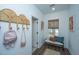 Inviting entryway with decor, bench seating, and stylish storage solutions at 111 Augusta Pass Dr, Ridgeville, SC 29472