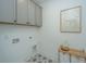 Laundry room features cabinetry and tile flooring at 111 Augusta Pass Dr, Ridgeville, SC 29472