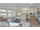 Bright and airy living room with neutral tones, hardwood floors, and lots of natural light at 111 Augusta Pass Dr, Ridgeville, SC 29472
