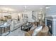 Open concept living area with fireplace flows into the dining and kitchen area at 111 Augusta Pass Dr, Ridgeville, SC 29472