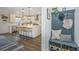Mudroom with built-in bench seating, storage cubbies, and view into the kitchen at 111 Augusta Pass Dr, Ridgeville, SC 29472