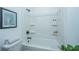 Clean white shower features a tub and built in shelves at 111 Augusta Pass Dr, Ridgeville, SC 29472