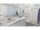 Bright bathroom featuring a white vanity, sleek faucet, and modern decor elements at 112 Orchard Blossom Ln, Summerville, SC 29485