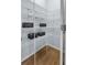 Walk-in pantry features ample white wire shelving, providing plenty of storage space for your needs at 112 Orchard Blossom Ln, Summerville, SC 29485