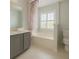 Bathroom featuring tiled floor, a vanity with sink, toilet, and a tub at 113 Rockdale Ln, Goose Creek, SC 29445