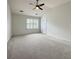 Large bedroom with a vaulted ceiling, large window, and plush carpeting at 113 Rockdale Ln, Goose Creek, SC 29445