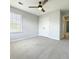 Bright bedroom with neutral walls, plush carpeting, and large window overlooking exterior at 113 Rockdale Ln, Goose Creek, SC 29445