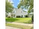 Side view of a two-story home showing well-maintained landscaping, a lush lawn, and classic siding at 113 Rockdale Ln, Goose Creek, SC 29445