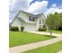 Well-maintained two-story home features a lush green lawn, two-car garage, and a classic architectural design at 113 Rockdale Ln, Goose Creek, SC 29445