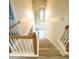 View from the top of the stairs of a foyer with large windows and a chandelier at 113 Rockdale Ln, Goose Creek, SC 29445