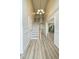 Inviting foyer showcasing wood-look floors, high ceilings, chandelier, and a staircase leading to the second floor at 113 Rockdale Ln, Goose Creek, SC 29445