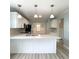 Bright kitchen with white cabinets, a kitchen island, and modern appliances, perfect for cooking and entertaining at 113 Rockdale Ln, Goose Creek, SC 29445