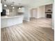 Open floor plan features a spacious living room with a fireplace, and a modern kitchen at 113 Rockdale Ln, Goose Creek, SC 29445