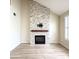 Contemporary living room featuring a fireplace, hardwood floors, and neutral walls at 113 Rockdale Ln, Goose Creek, SC 29445