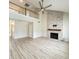 Spacious living room boasting a fireplace, hardwood floors, and a view into the kitchen and second story at 113 Rockdale Ln, Goose Creek, SC 29445