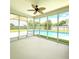 Enclosed patio with full pool view and blue skies is perfect for relaxation and entertaining at 113 Rockdale Ln, Goose Creek, SC 29445