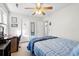 The bedroom includes neutral carpet, a ceiling fan, and a desk at 113 Surrey Dr, Summerville, SC 29486