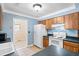 Eat-in kitchen features wood cabinets, tile floor, and white appliances at 113 Surrey Dr, Summerville, SC 29486