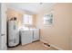 Bright laundry room with washer, dryer, and ample storage space at 113 Surrey Dr, Summerville, SC 29486