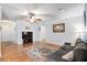 Inviting living room with hardwood floors, a ceiling fan, and a comfortable gray sofa at 113 Surrey Dr, Summerville, SC 29486