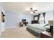 The main bedroom includes neutral carpet, a ceiling fan, and a window at 113 Surrey Dr, Summerville, SC 29486