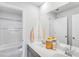 Modern bathroom with double sink vanity, large mirror, and separate tub at 114 Orchard Blossom Ln, Summerville, SC 29485