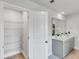 Bathroom with open door to storage and double sink vanity at 114 Orchard Blossom Ln, Summerville, SC 29485