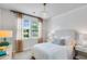 Cozy bedroom with neutral decor, a comfortable bed, and ample natural light through the window at 114 Orchard Blossom Ln, Summerville, SC 29485