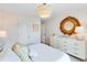 Tastefully decorated bedroom featuring decorative mirror and large window at 114 Orchard Blossom Ln, Summerville, SC 29485