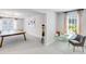 Inviting bonus room with desk and ping pong table near bright window at 114 Orchard Blossom Ln, Summerville, SC 29485