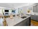 Spacious kitchen flows into the dining and living areas, offering an open concept design with granite counters at 114 Orchard Blossom Ln, Summerville, SC 29485