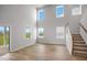 Living room with an abundance of natural light, hardwood floors, and a staircase at 114 Orchard Blossom Ln, Summerville, SC 29485
