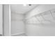 Bright walk-in closet featuring white wire shelving and neutral carpet at 114 Orchard Blossom Ln, Summerville, SC 29485