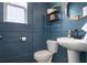 Stylish powder room with navy blue wainscoting and modern fixtures at 115 Winding Branch Dr, Summerville, SC 29486