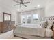 Bright bedroom with a comfortable bed, a dresser, and natural light from large windows at 115 Winding Branch Dr, Summerville, SC 29486