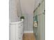 Stylish hallway features modern wallpaper, coat hooks, and a white storage cabinet at 115 Winding Branch Dr, Summerville, SC 29486