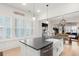 Bright, modern kitchen with island, pendant lights, and large windows for plenty of natural light at 115 Winding Branch Dr, Summerville, SC 29486
