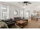 Bright living room with a large sectional sofa, ceiling fan, and natural light at 115 Winding Branch Dr, Summerville, SC 29486