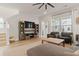 Comfortable living room featuring a large TV, ceiling fan, and cozy seating at 115 Winding Branch Dr, Summerville, SC 29486