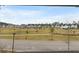 Neighborhood street showing houses, green space and landscape at 115 Winding Branch Dr, Summerville, SC 29486