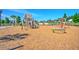 Community playground with equipment for children and ample space for recreation with nearby homes at 115 Winding Branch Dr, Summerville, SC 29486