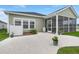 Backyard featuring a concrete patio, green grass, and a screened-in porch at 1150 Cooper Point St, Summerville, SC 29485
