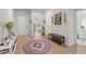 Bright entryway features wood floors, stylish decor, and views into other rooms at 1150 Cooper Point St, Summerville, SC 29485