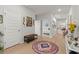 Stylish entryway with wood floors, a decorative rug, and views of a bedroom and living room at 1150 Cooper Point St, Summerville, SC 29485