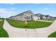 Street view of a well-maintained single Gathering home with green lawn and concrete sidewalk at 1150 Cooper Point St, Summerville, SC 29485