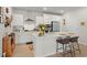 Bright and airy kitchen features a large island with seating, modern appliances, and white cabinets at 1150 Cooper Point St, Summerville, SC 29485
