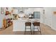 Bright kitchen features a large island with seating, modern appliances, and ample countertop space at 1150 Cooper Point St, Summerville, SC 29485