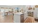 Kitchen island with stainless steel dishwasher that opens to the dining and living area at 1150 Cooper Point St, Summerville, SC 29485