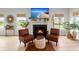 Bright living room featuring a fireplace and stylish seating, filled with natural light at 1150 Cooper Point St, Summerville, SC 29485